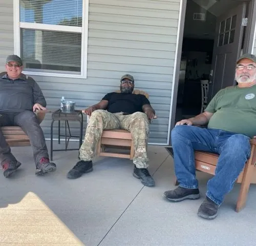 The "Boys" relaxing on the bunkhouse porch after breakfast- Sep 2022