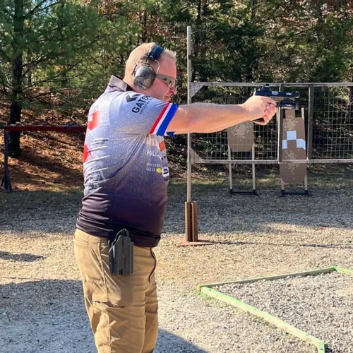 Todd Kunz taking a sight picture prior to shooting a stage- Gatorz MO Fall Classic- OCT2024