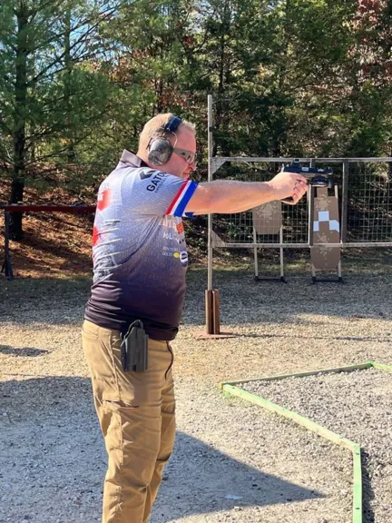 Todd Kunz taking a sight picture prior to shooting a stage- Gatorz MO Fall Classic- OCT2024