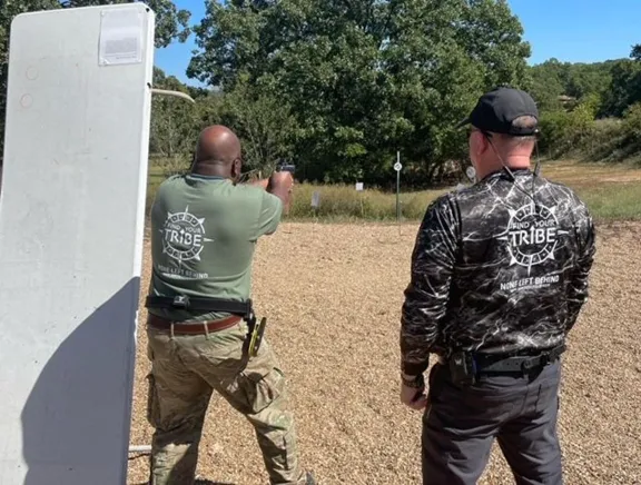 Mark coaching Gordon on advanced pistol skills- Sep 2022