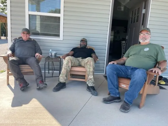 The "Boys" relaxing on the bunkhouse porch after breakfast- Sep 2022