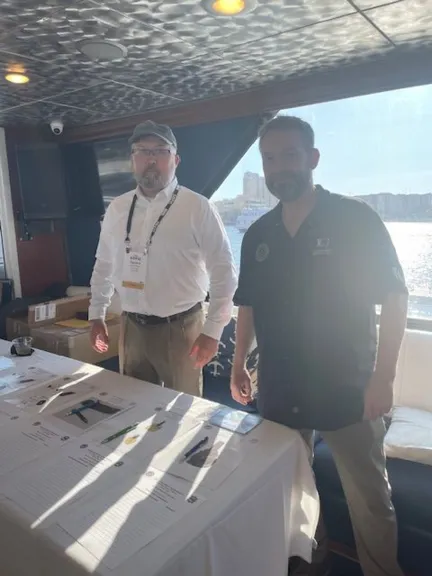 SOCN's Dave Poland and Jim Barnett at Silent Auction Table